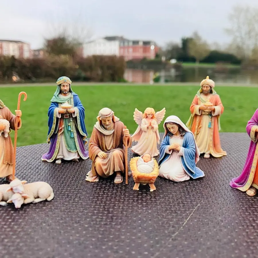 A nine-piece hand-finished nativity figurine set
